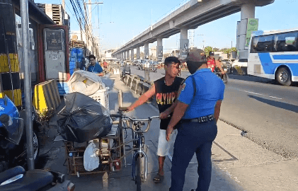 Pedicab driver collecting garbage intercepted by MMDA in Marcos Highway