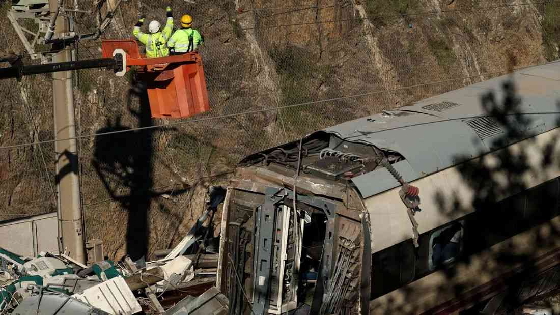 Spain deploys heavy machinery to find missing bodies among train crash wreckage