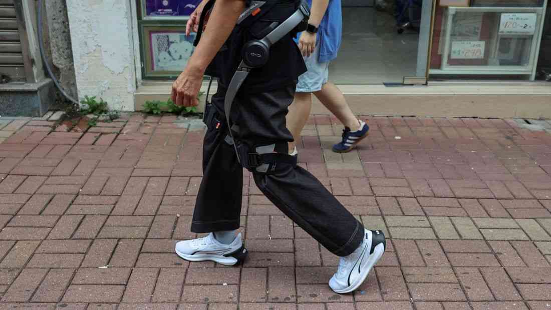 Robotic legs help elderly Hong Kong fire survivors climb back for belongings