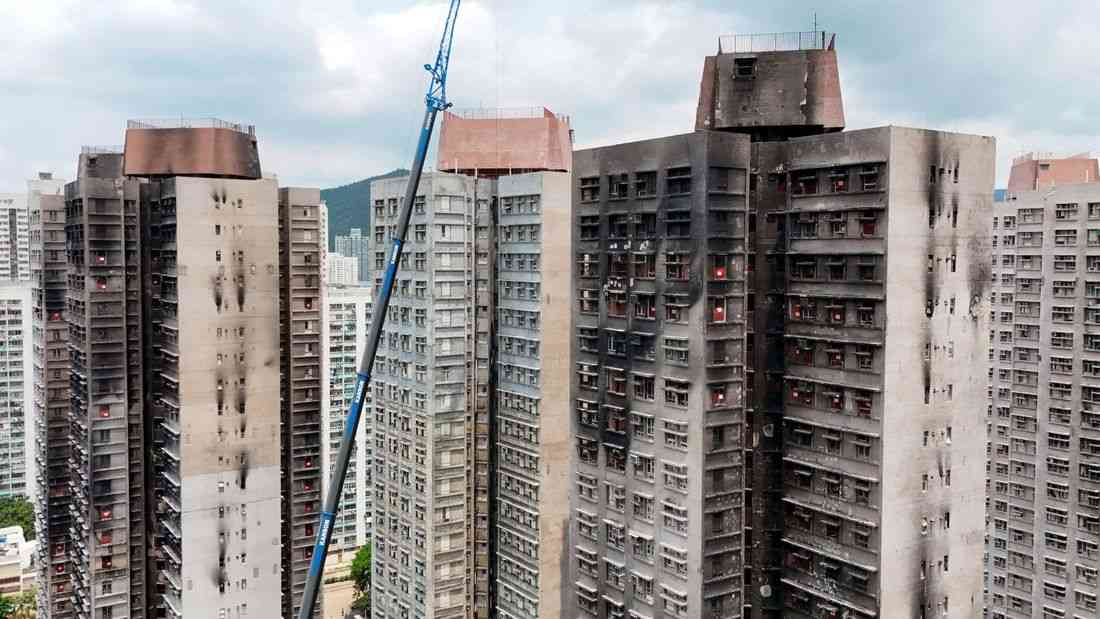 Hong Kong fire victims scour scorched homes for keepsakes