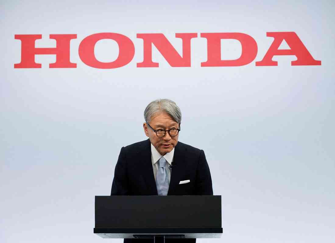Honda CEO apologises for company's loss, wins investor backing at annual meeting