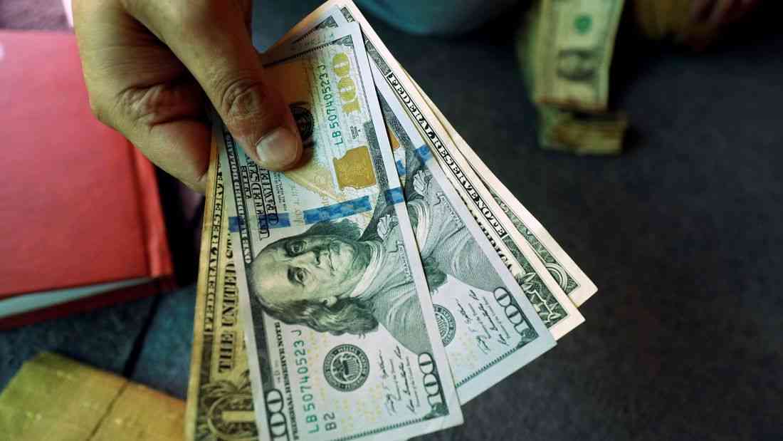 Dollar near two-week lows as rate-hike bets recede, embattled yen in focus