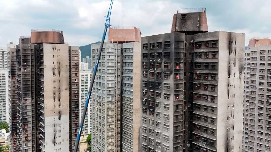 Hong Kong fire victims scour scorched homes for keepsakes