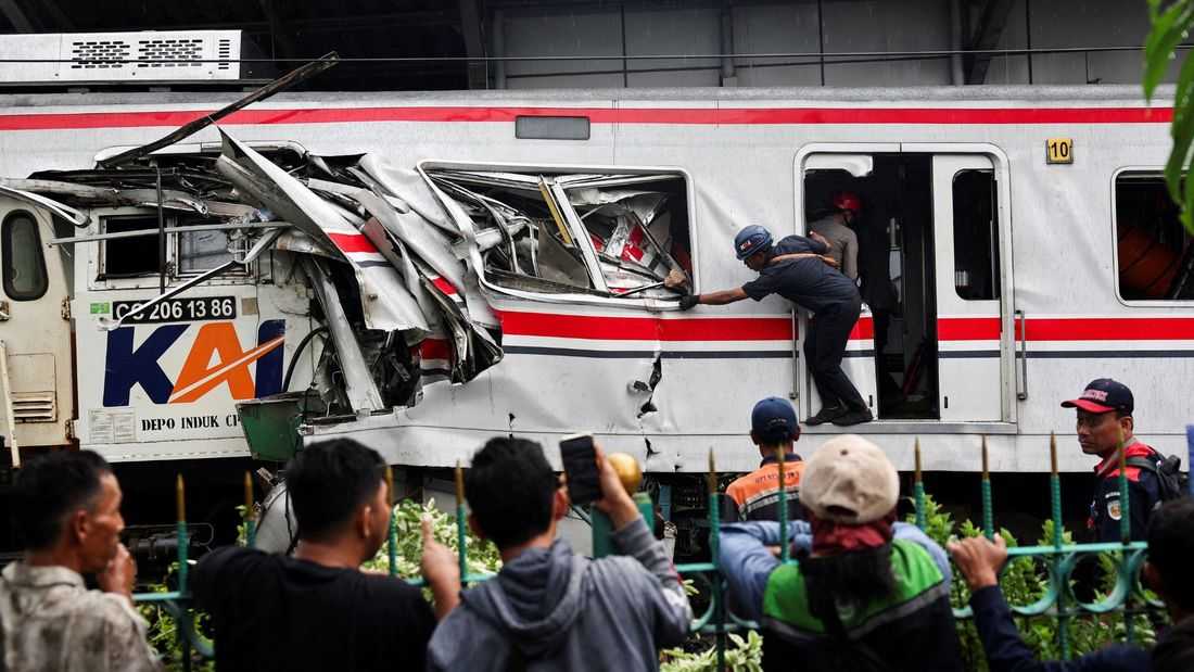 Indonesia train crash toll rises to 14 as rescuers work to remove trapped passengers