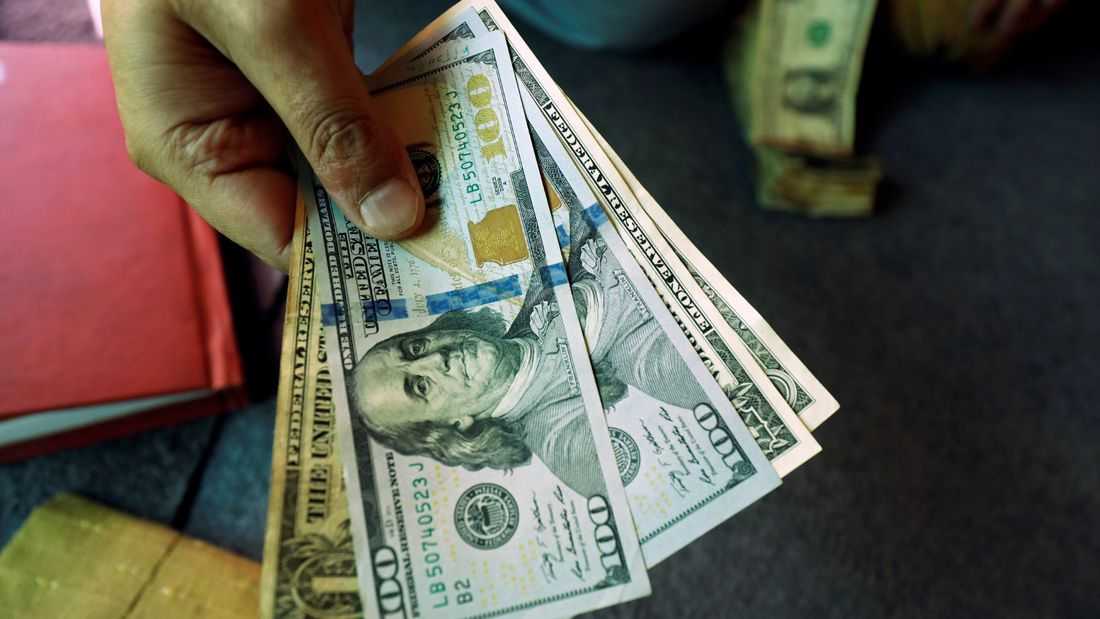 Dollar near two-week lows as rate-hike bets recede, embattled yen in focus