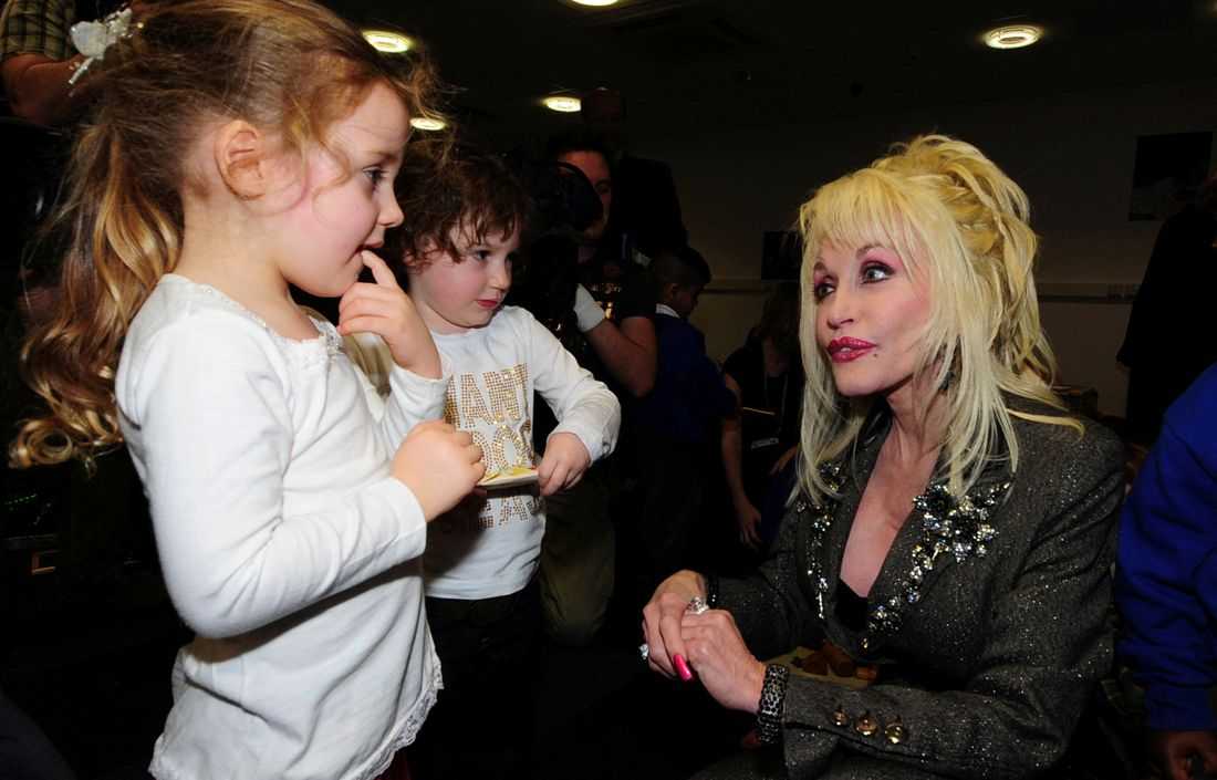Dolly Parton's legacy lives on through book deliveries to kids