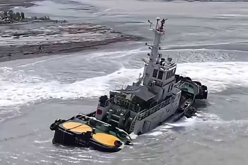 PCG rescues 9 seafarers after tugboat runs aground in Zambales
