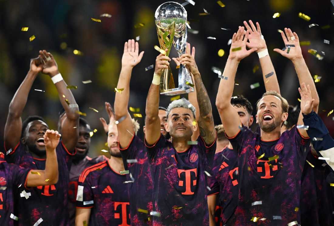 Soccer-Bayern battle past Dortmund 2-1 to win German Supercup