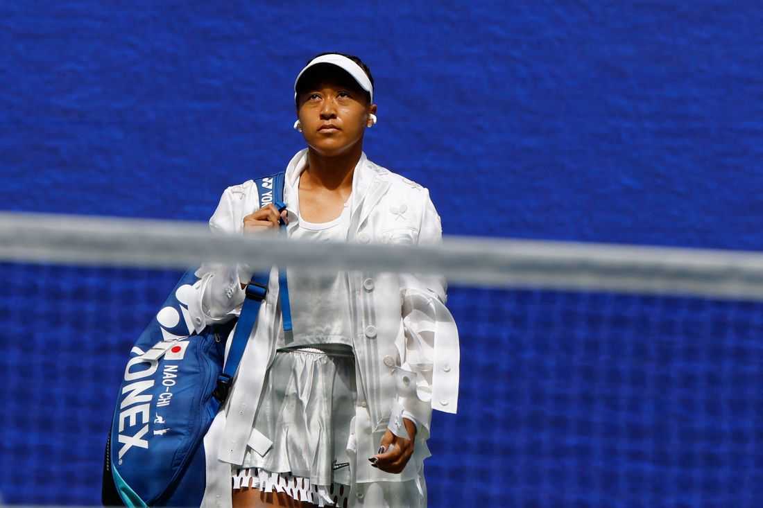 Tennis-Osaka holds her nerve to reach US Open third round