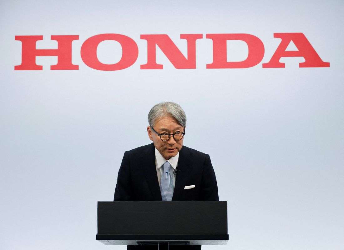 Honda CEO apologises for company's loss, wins investor backing at annual meeting
