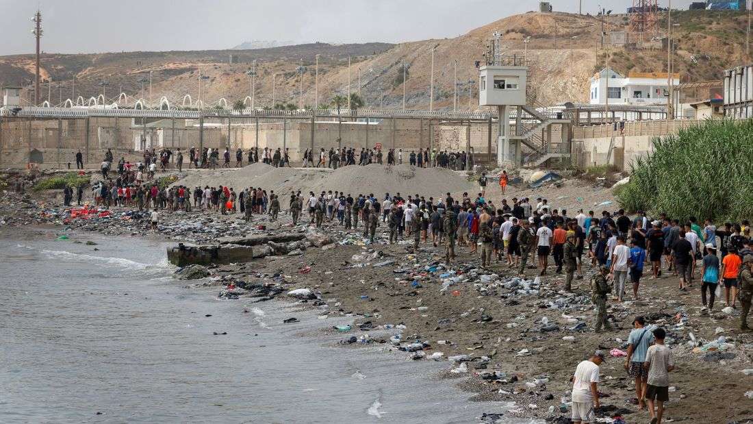 Spain says migrants are returning from Ceuta after 57 die in border rush