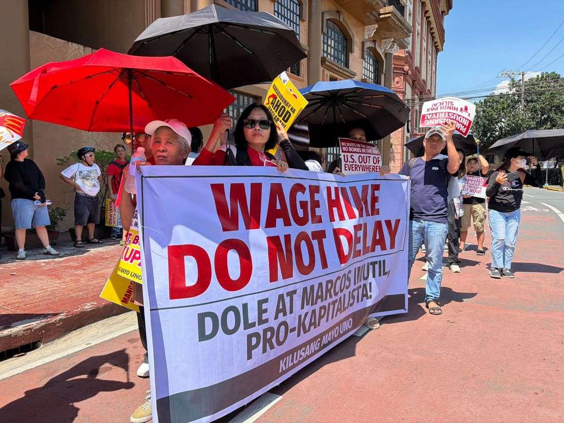 Protesters gather at DOLE office, children in tow