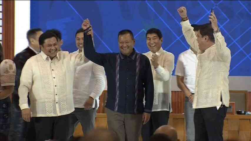 Brothers Jinggoy Estrada, JV Ejercito raise each other's hand after senatorial proclamation