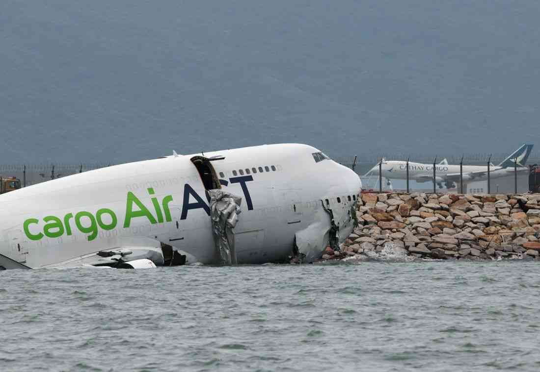 Cargo plane slides off runway in Hong Kong, media reports two dead