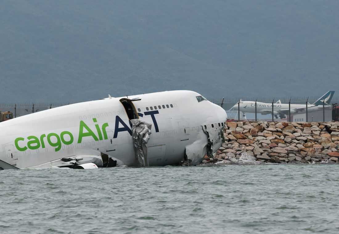 Cargo plane slides off runway in Hong Kong, media reports two dead