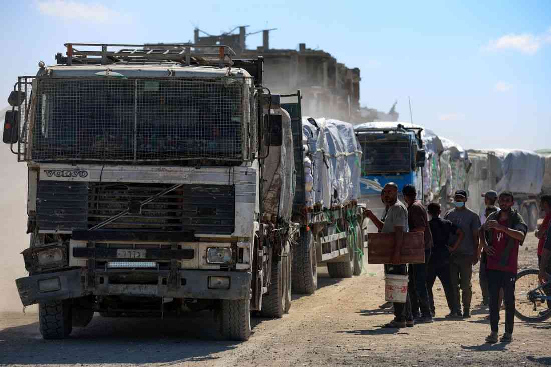 Aid trucks roll into Gaza as dispute over hostage bodies is paused