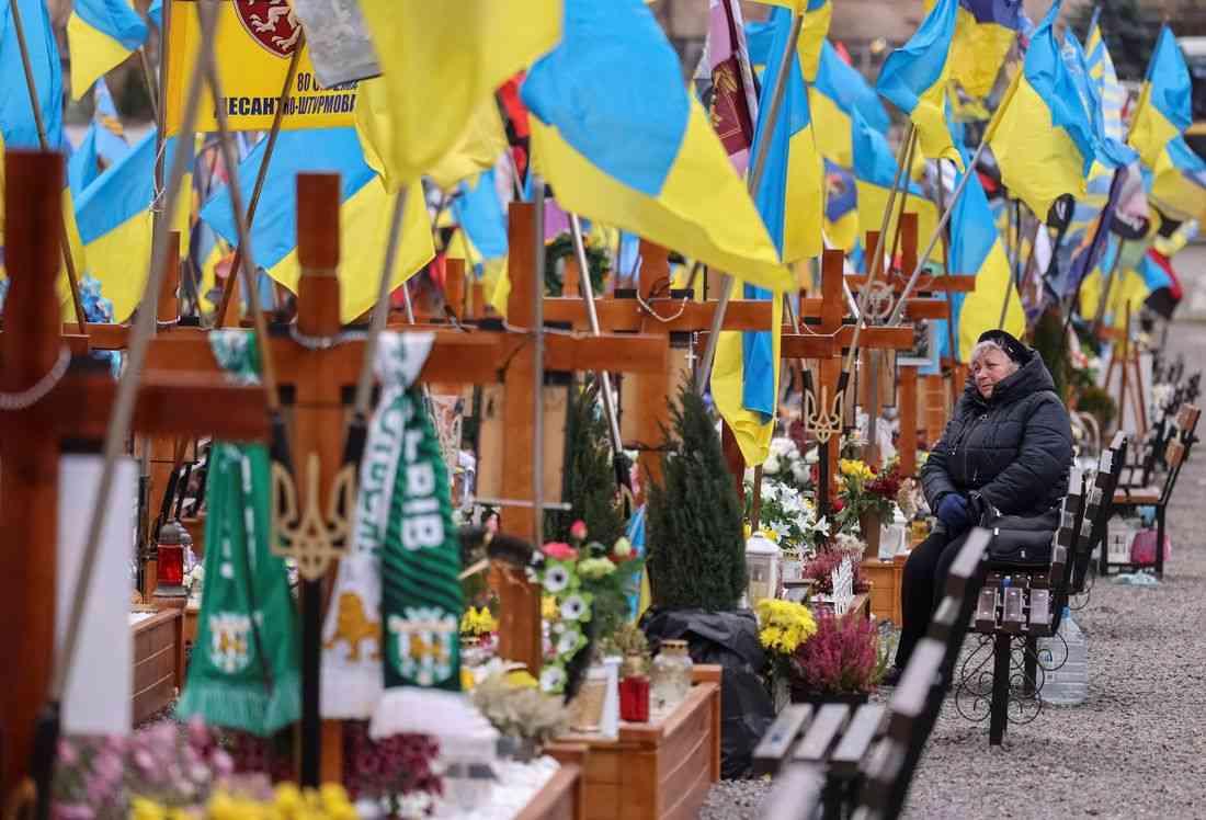 At crowded Ukrainian cemetery, mourners yearn for war to end