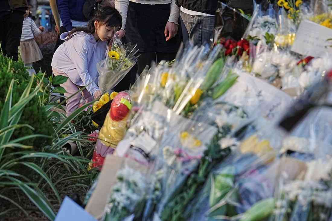 Hong Kong mourns victims of blaze that killed 128 and counting