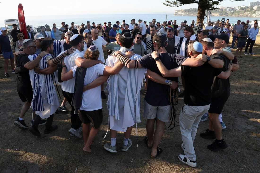 Australia plans gun buyback after Bondi massacre, as surfers honour victims