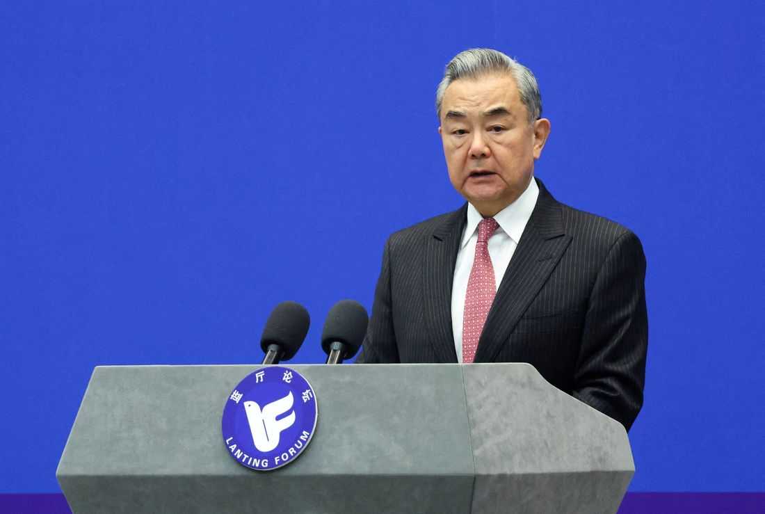China's foreign minister urges France to support its position on Japan