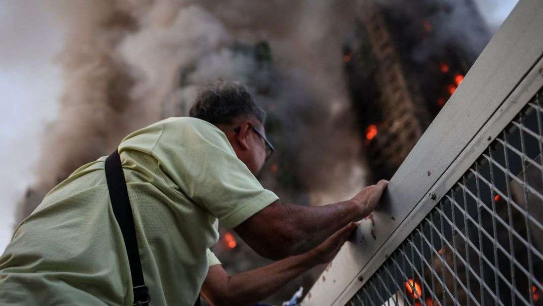 Hong Kong fire: Echoes of loss below burnt towers