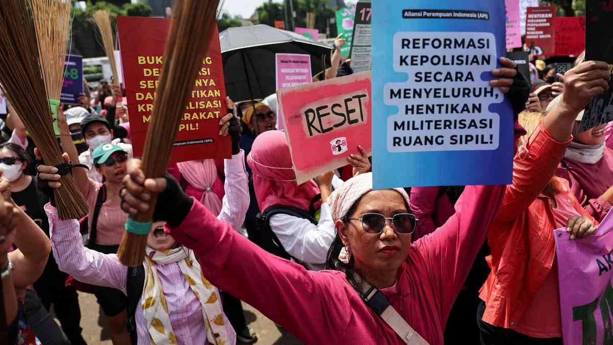 With brooms in hand as symbol for change, Indonesian women join Jakarta protests