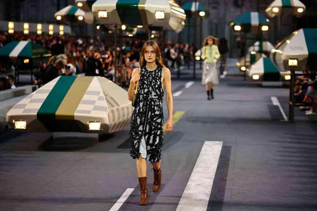 Louis Vuitton shows slinky dresses and fluid jackets, adapts to warming world