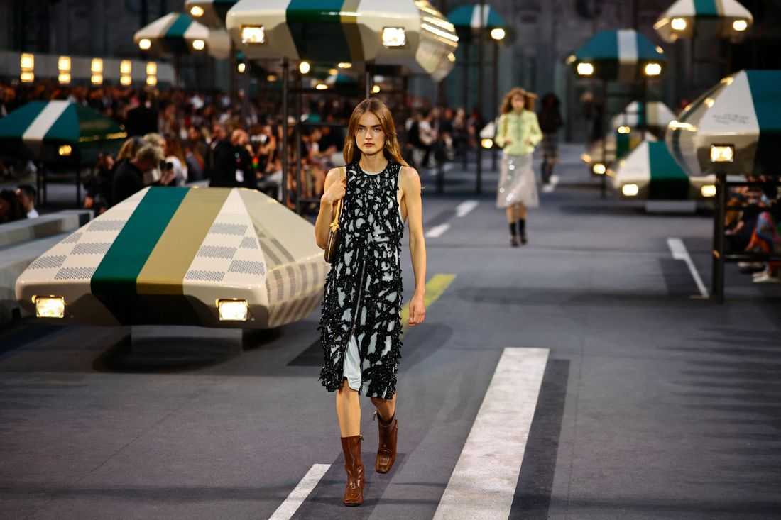 Louis Vuitton shows slinky dresses and fluid jackets, adapts to warming world