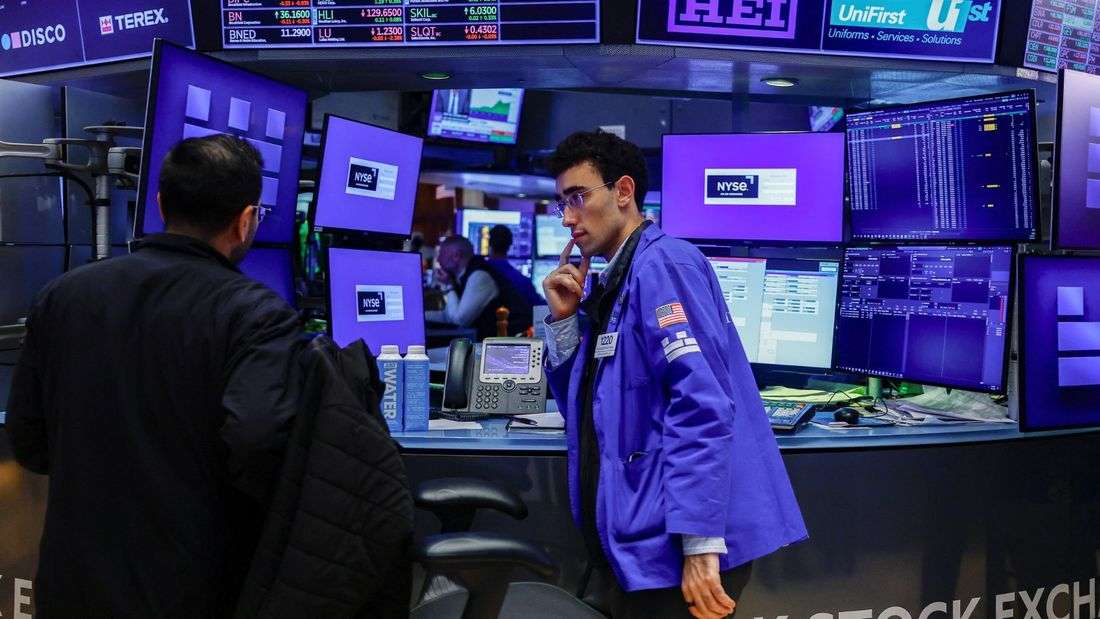Stocks slip as dollar heads for weekly loss