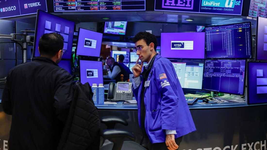 Stocks slip as dollar heads for weekly loss