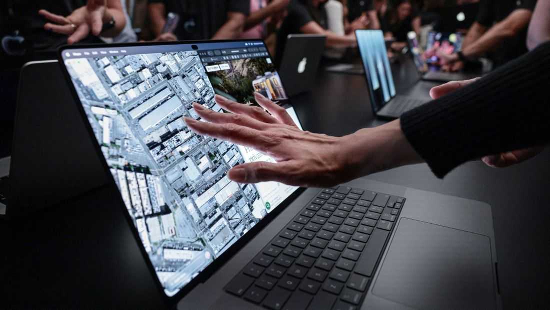 Apple shows pricey touchscreen laptops, a first for the iPhone maker