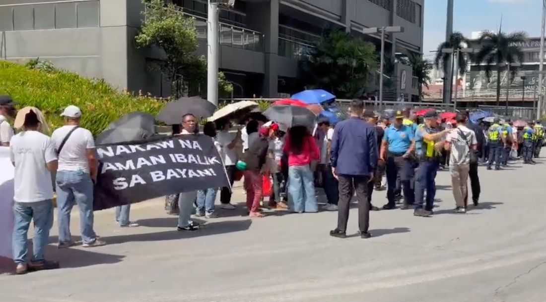 Anti-Duterte protesters rally outside Sara Duterte’s office in Mandaluyong City