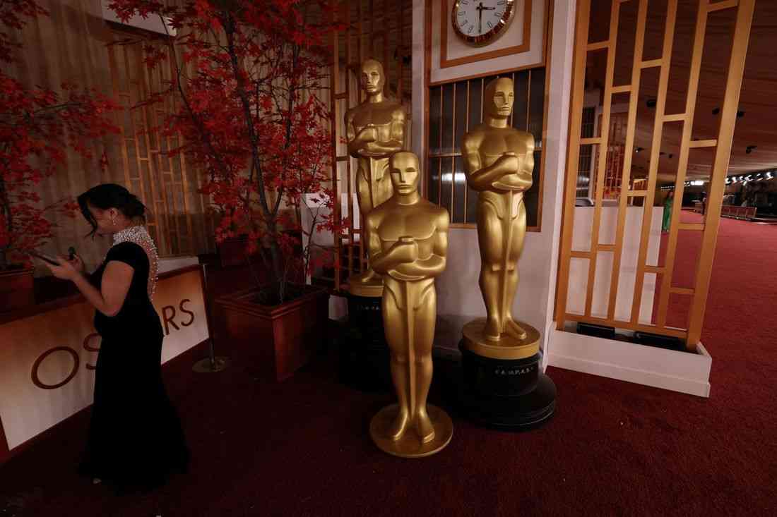 Hollywood stars arrive at unpredictable Oscars