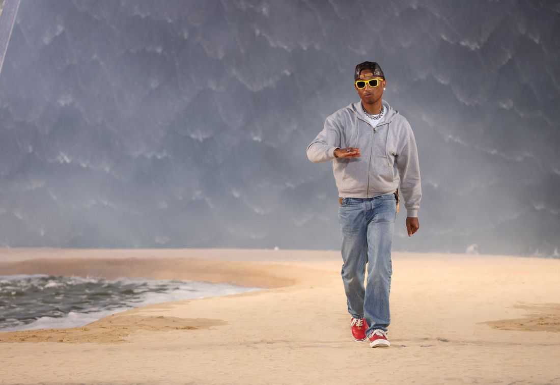 Louis Vuitton designer Pharrell Williams borrows from California surf culture as heatwave hits Paris