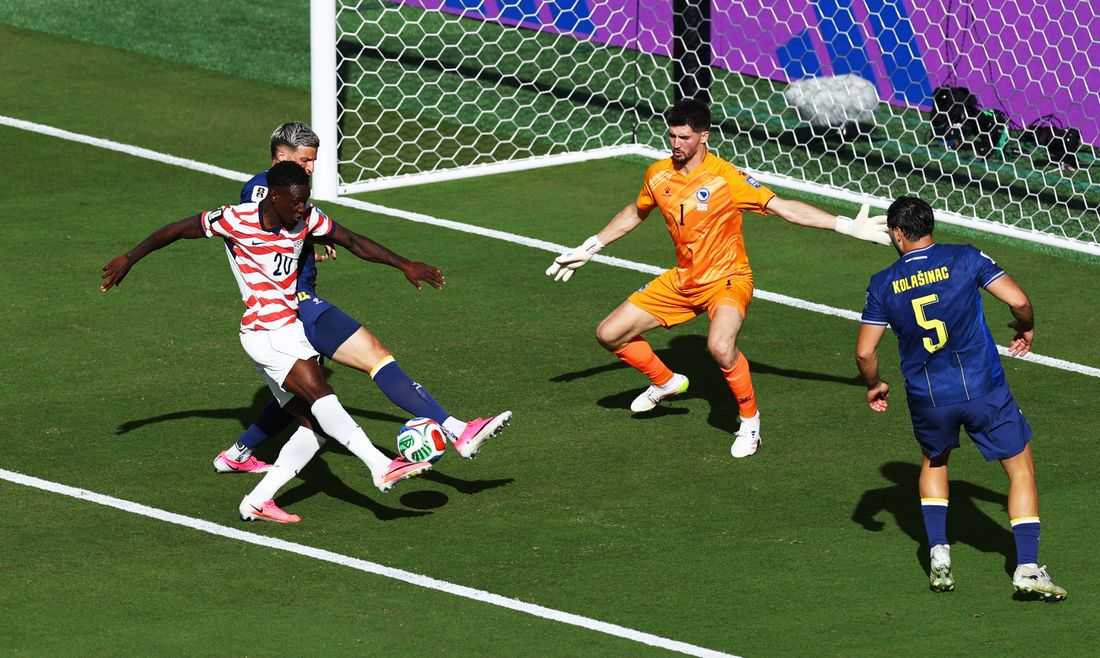 Soccer-Balogun goes from hero to suspended spectator as US advance