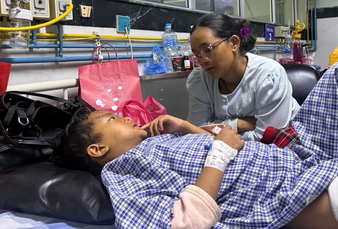 Mother reunited with 8-year-old who climbed trees to survive Nepal floods