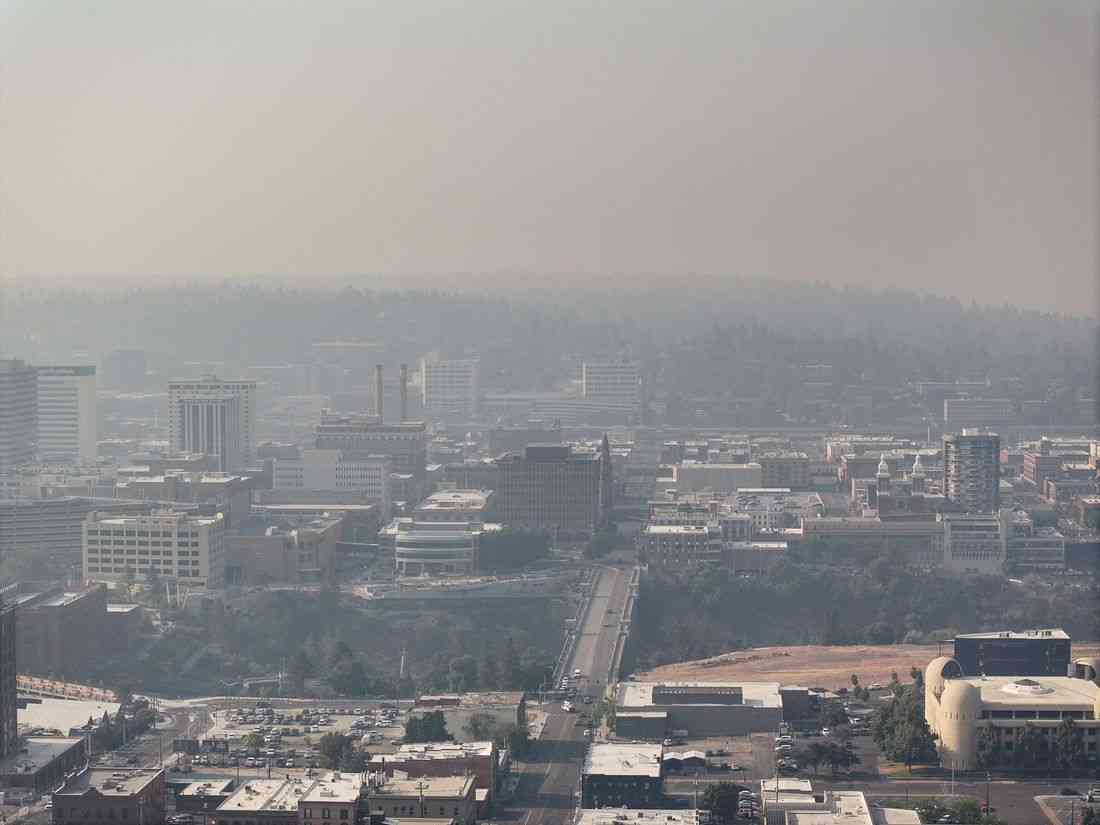 Wildfires near Spokane destroy more than 700 buildings, force 64,000 to flee