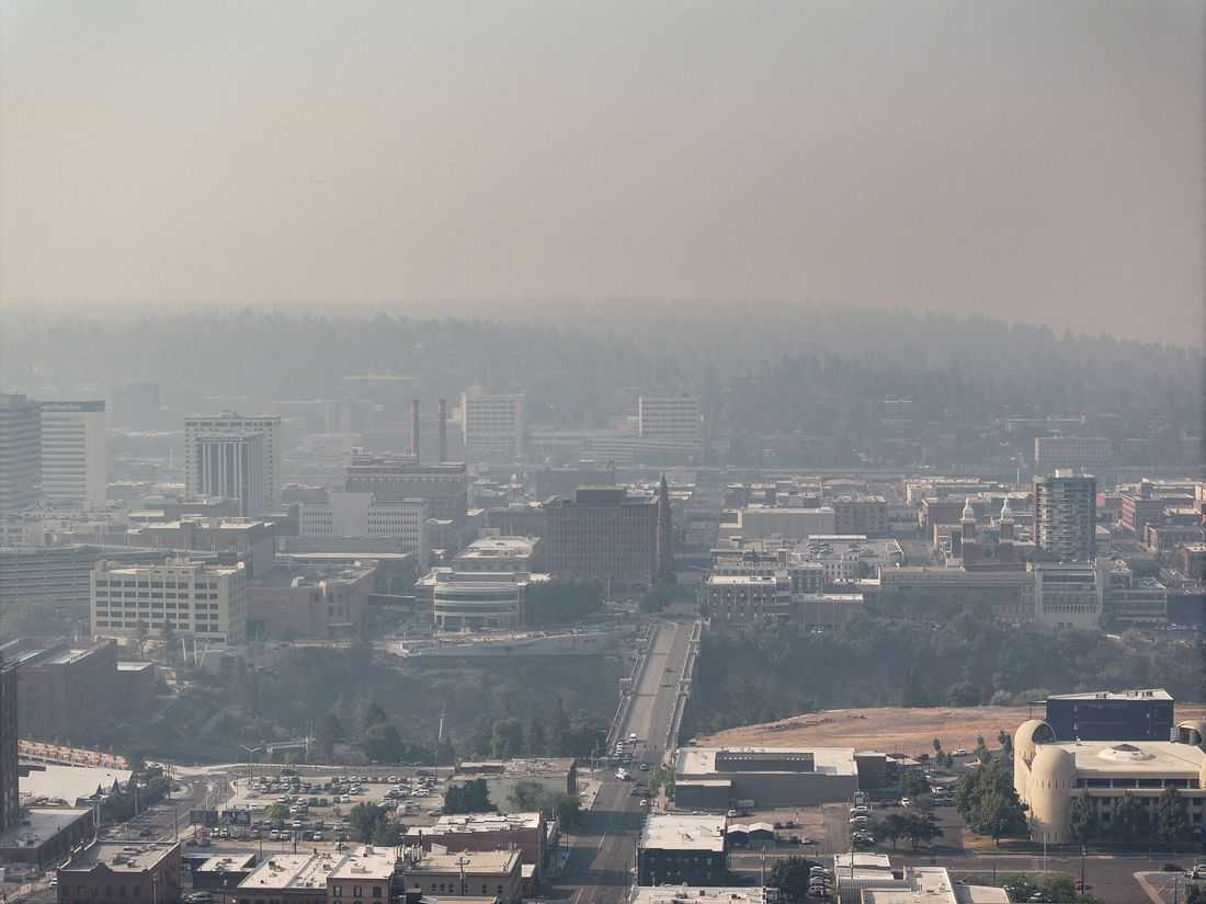 Wildfires near Spokane destroy more than 700 buildings, force 64,000 to flee
