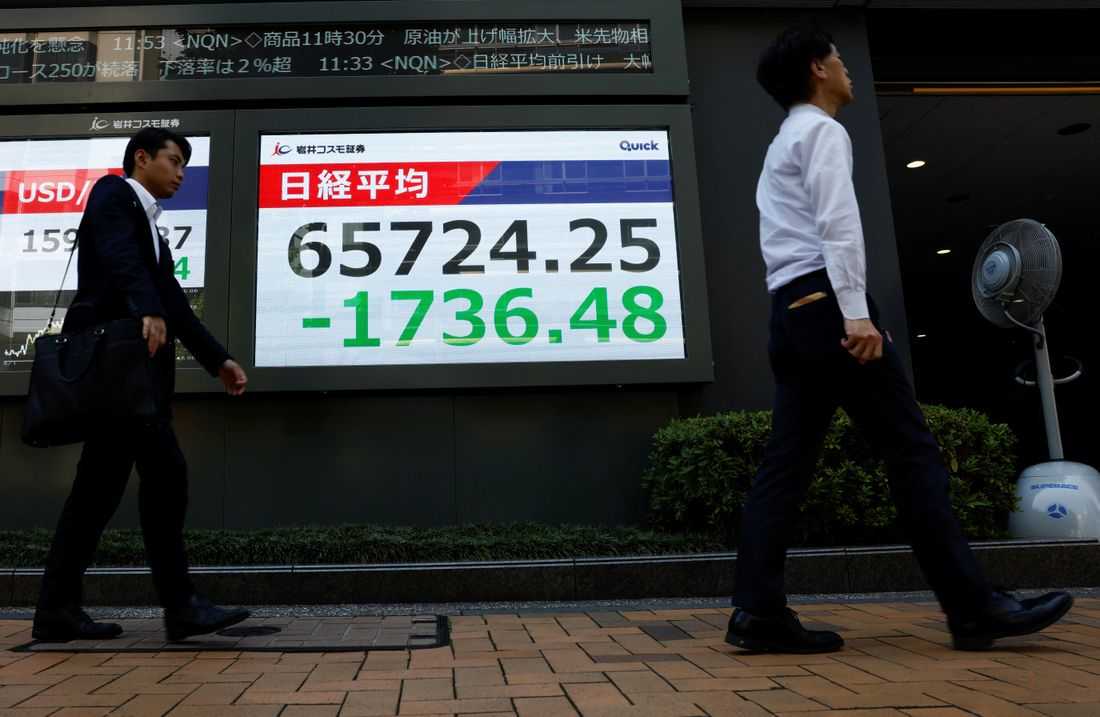 Asia stocks waver as yen surges, Iran warns of retaliation