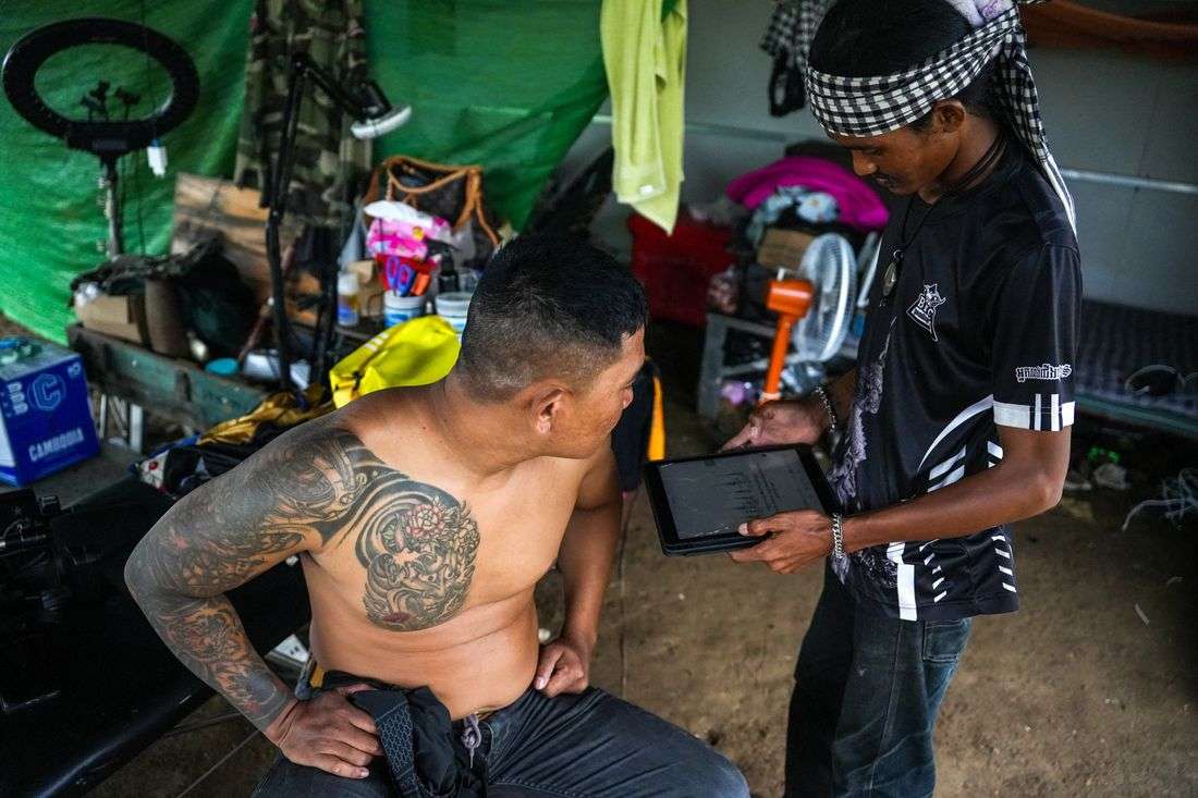 In Cambodia's 'Waiting Village', tattooist mourns trade lost to war