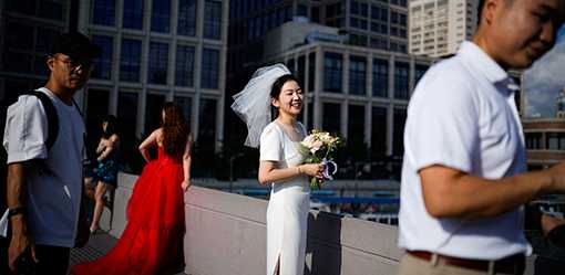 China, battling low birth rates and high costs, encourages frugal weddings