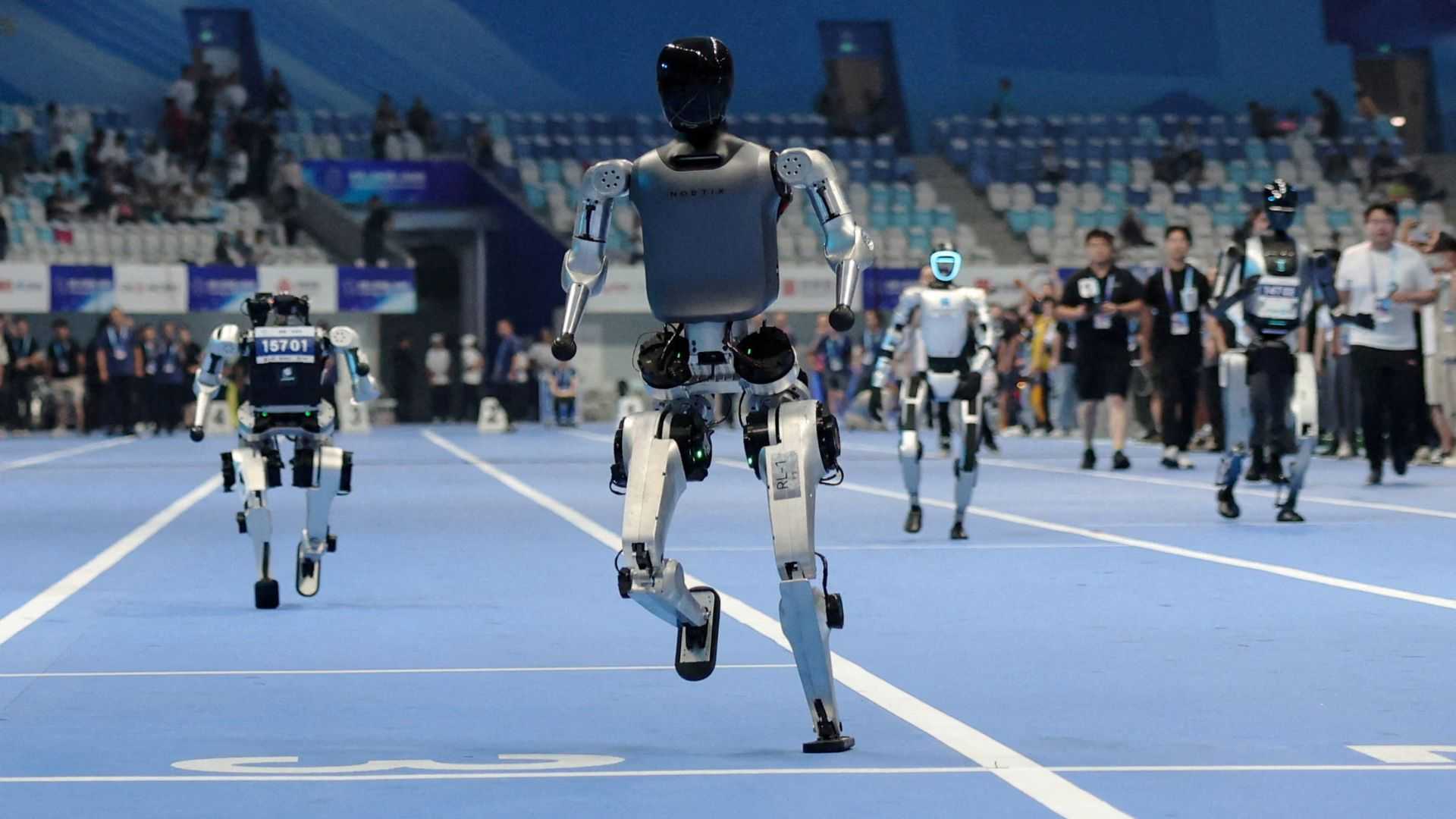 China's 'robot Olympics' sees humanoids from 16 nations compete in table tennis, football, track