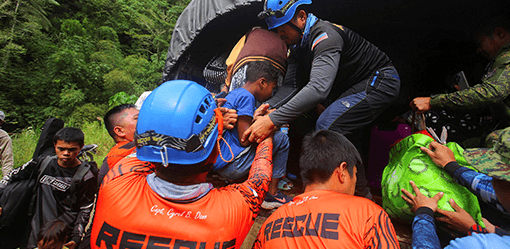 Rescued child raises hope of finding more survivors in Philippine landslide