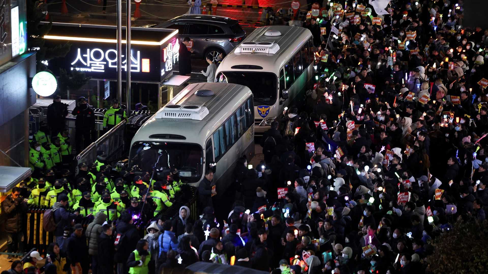 South Korea police raid Yoon's office over martial law as ousted minister attempts suicide