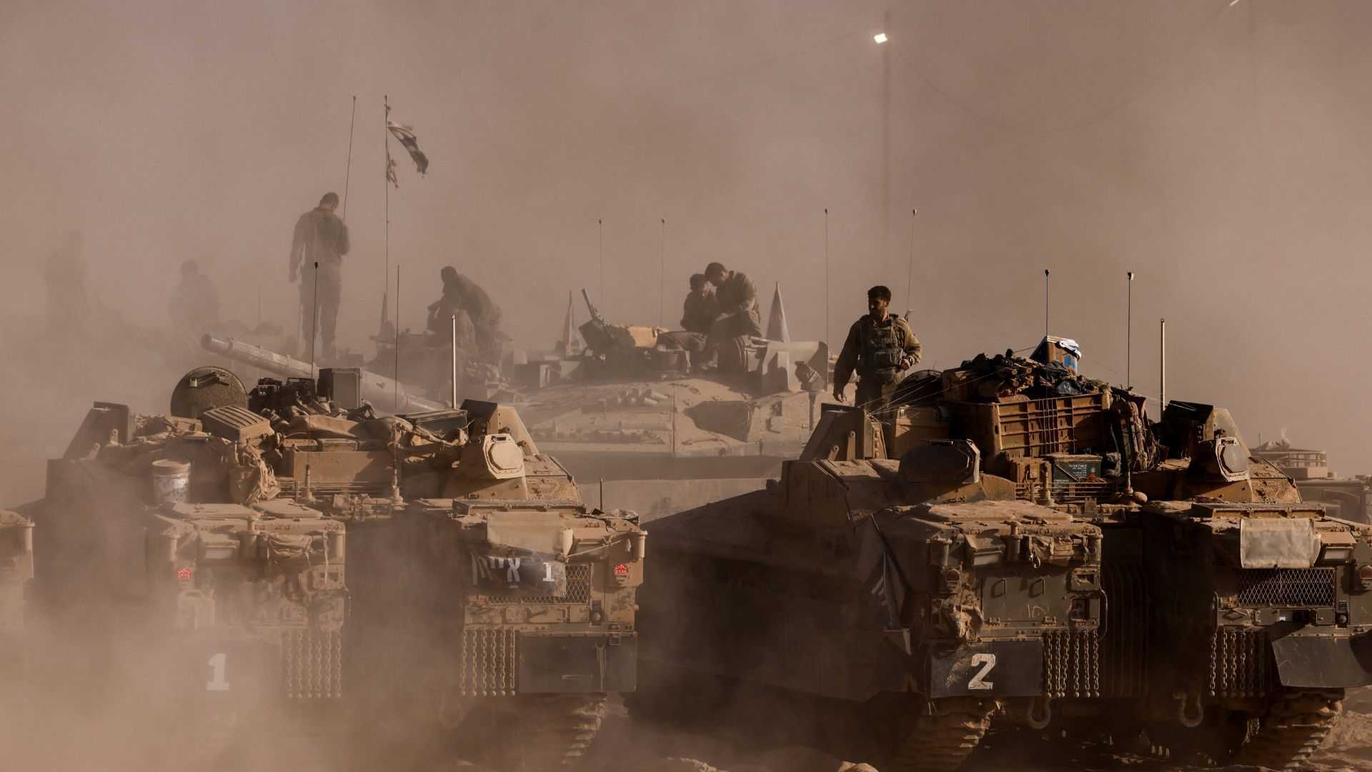 Thousands of Israeli reservists report for duty, as military chief clashes with ministers