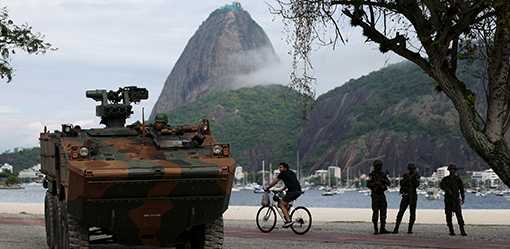 Troops, armored cars and patrol boats protect G20 summit