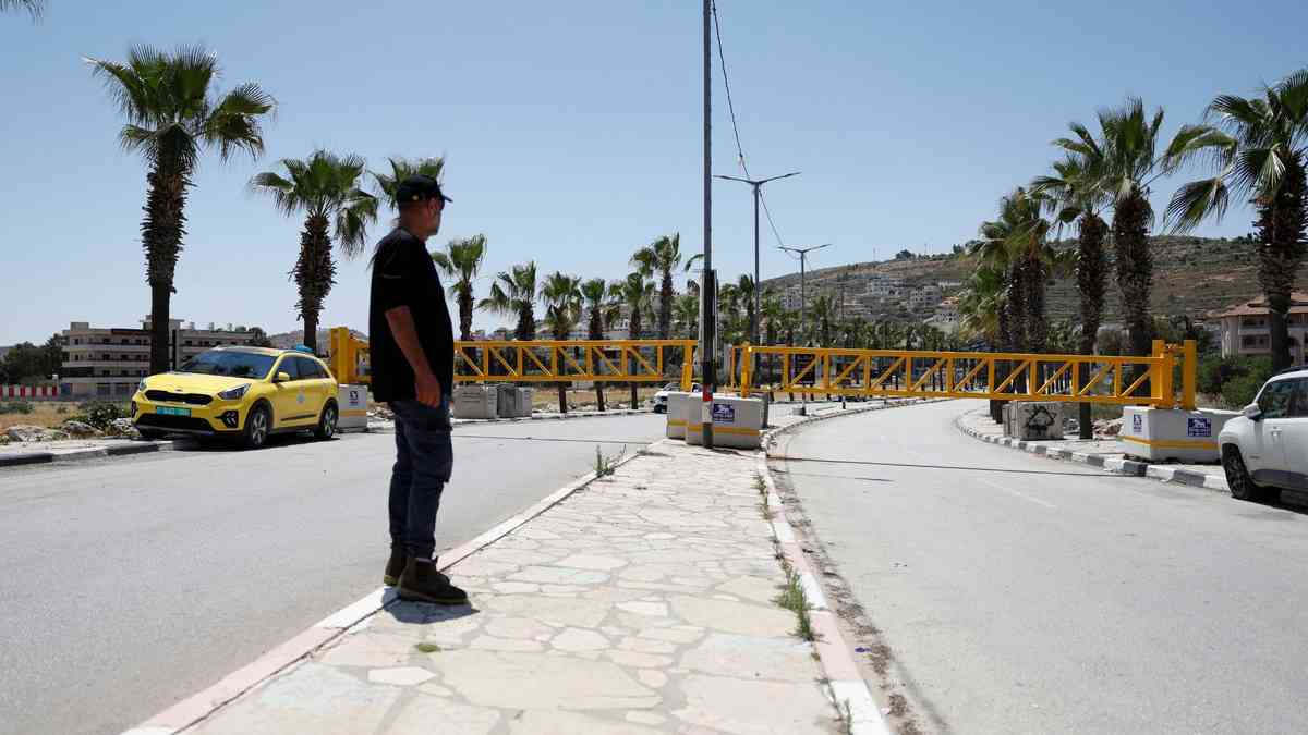 West Bank town becomes 'big prison' as Israel fences it in